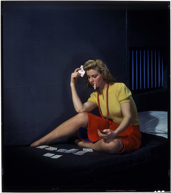 Nickolas Muray, "Woman in cell, playing solitaire", 1950 